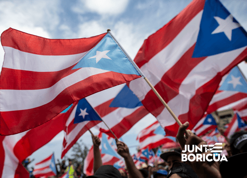 March of Puerto Ricans with Puerto Rico flag.